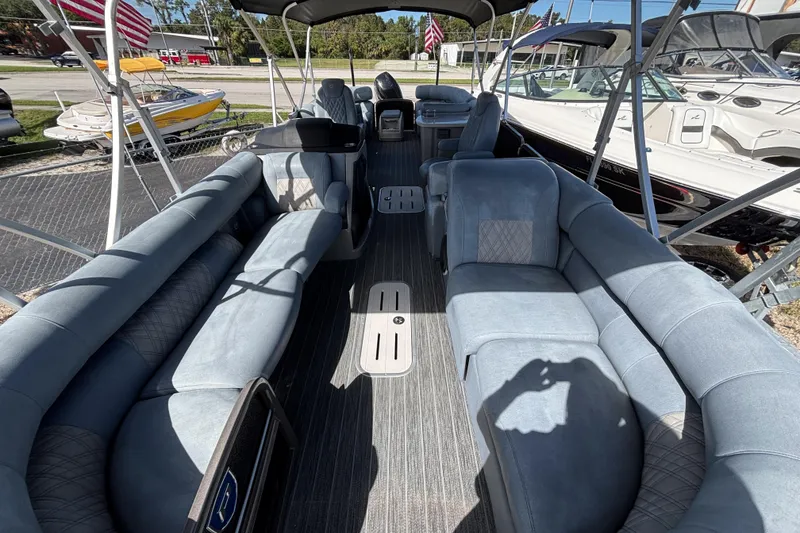 Slide: The Image of Interior of 2021 Premier 270 Intrigue RF pontoon boat with spacious seating and modern design. - 21