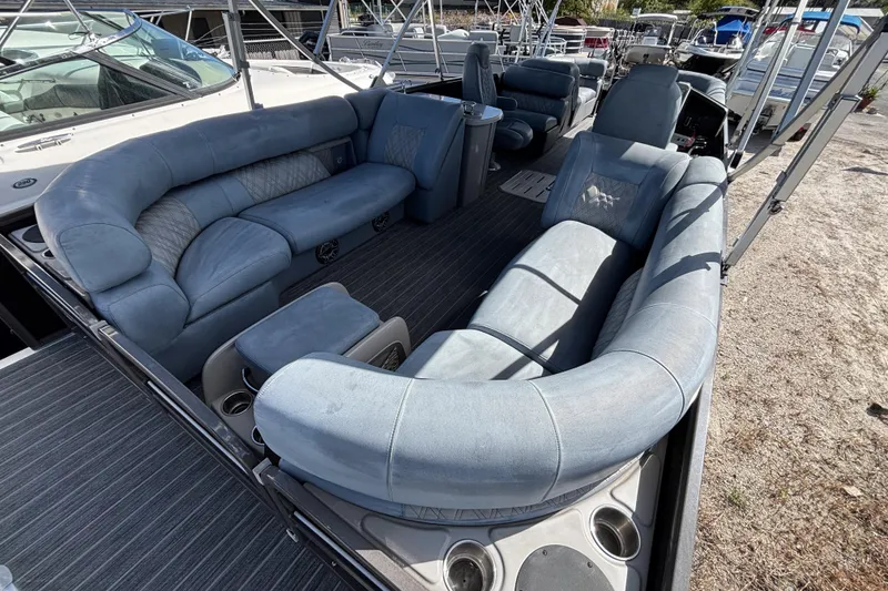 Slide: The Image of 2021 Premier 270 Intrigue RF boat interior with luxurious seating and cup holders. - 24
