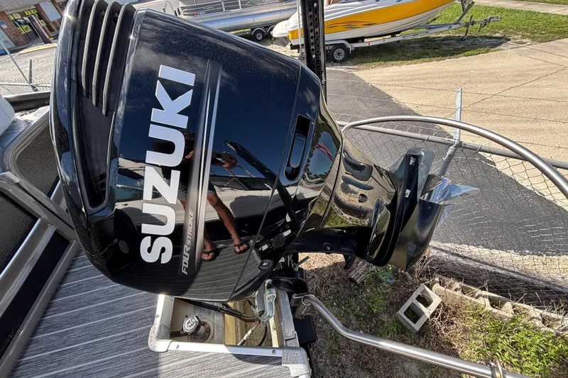 Slide: The Image of Suzuki four-stroke outboard motor on a 2021 Premier 270 Intrigue RF boat. - 26