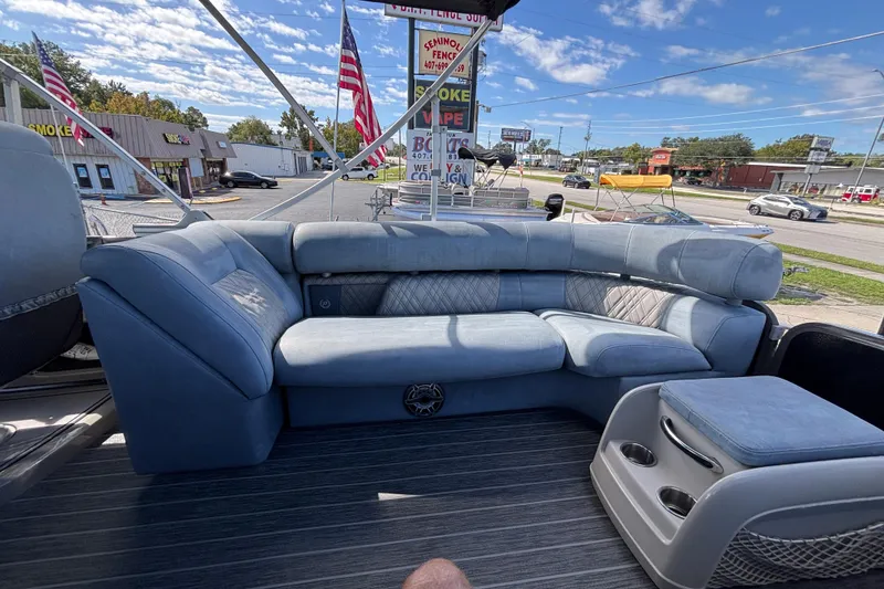 Slide: The Image of Premier 270 Intrigue RF 2021 boat interior with plush seating and cup holders. - 31