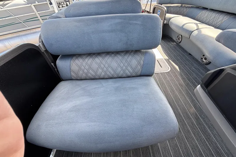 Slide: The Image of Luxurious seating on 2021 Premier 270 Intrigue RF boat, featuring plush gray upholstery. - 34