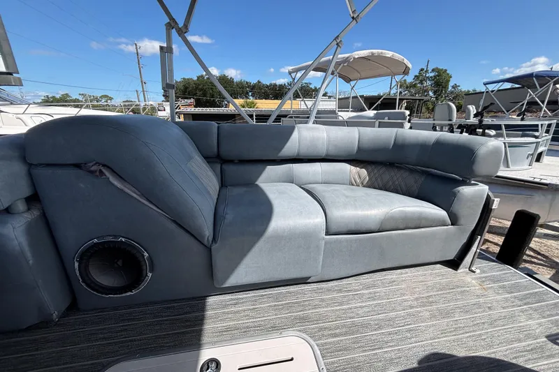 Slide: The Image of Premier 270 Intrigue RF 2021 boat with gray seating and outdoor deck. - 36