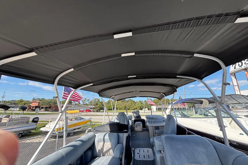 Slide: The Image of Interior view of 2021 Premier 270 Intrigue RF pontoon boat with canopy and seating. - 37