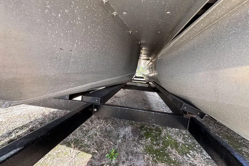 Slide: The Image of Underneath view of 2021 Premier 270 Intrigue RF pontoon boat, showcasing structural details. - 39