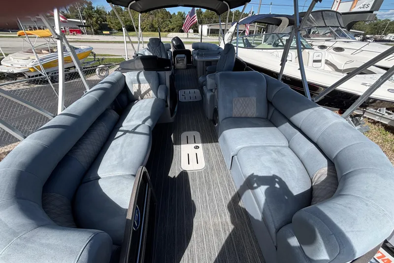 Slide: The Image of 2021 Premier 270 Intrigue RF pontoon boat with spacious seating and modern interior design. - 4