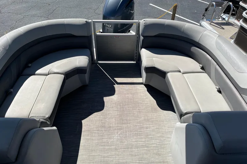 Slide: The Image of 2021 Bennington 22SRX pontoon boat with spacious seating and modern design. - 3