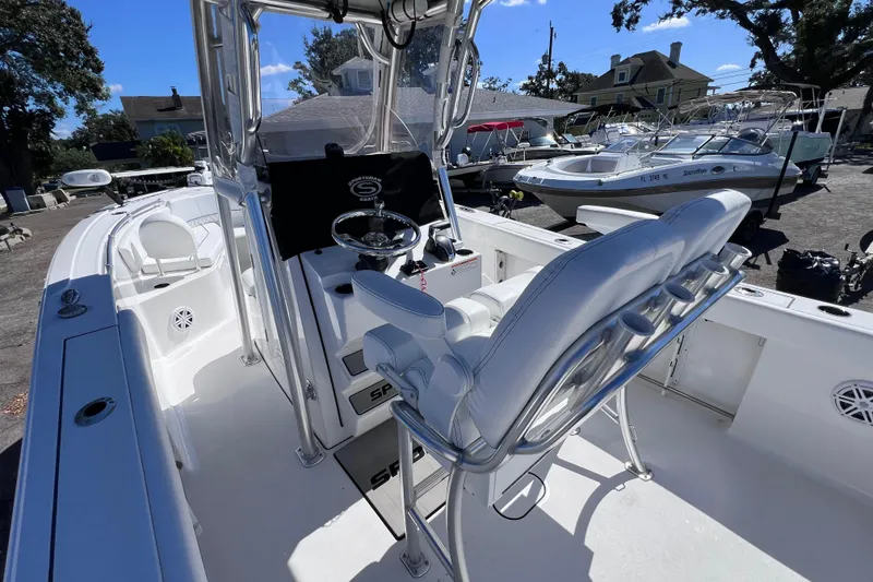 Slide: The Image of 2023 Sportsman Open 242 Center Console boat interior with helm and seating. - 17