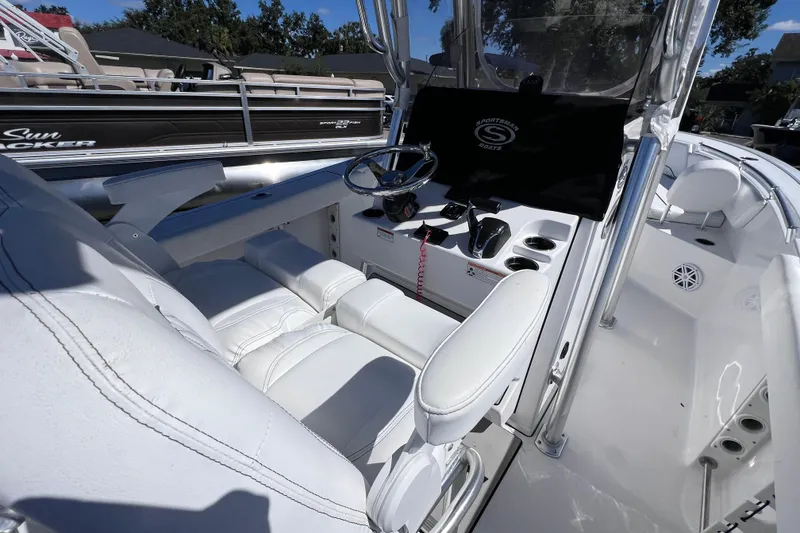 Slide: The Image of 2023 Sportsman Open 242 Center Console boat interior with steering wheel and seating. - 18
