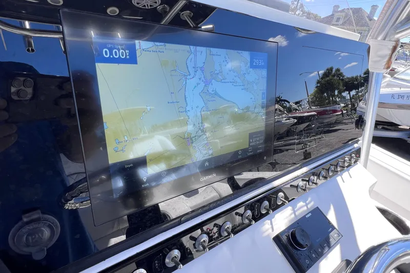 Slide: The Image of 2023 Sportsman Open 242 Center Console with Garmin navigation display. - 22
