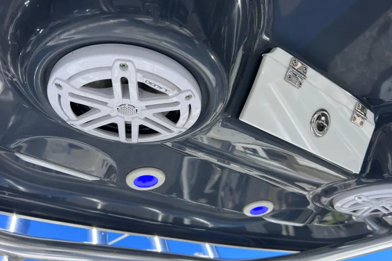 Slide: The Image of 2023 Sportsman Open 242 Center Console boat with speakers and LED lights. - 26