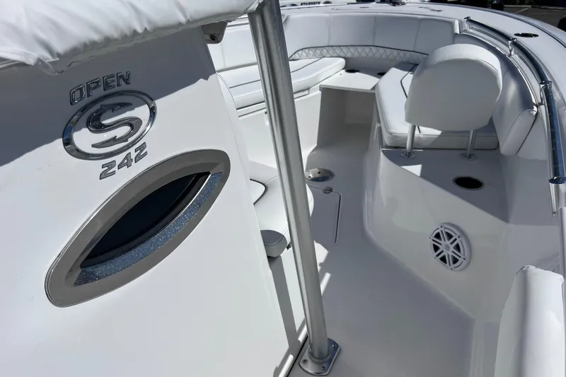 Slide: The Image of 2023 Sportsman Open 242 Center Console boat interior with seating and logo detail. - 30