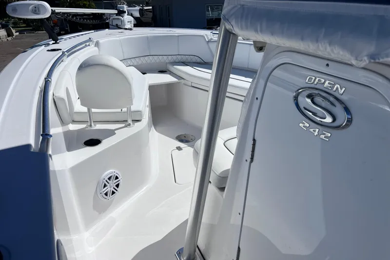 Slide: The Image of 2023 Sportsman Open 242 Center Console boat interior with seating and console details. - 31