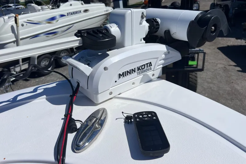Slide: The Image of Minn Kota Terrova motor on 2023 Sportsman Open 242 Center Console boat deck. - 34