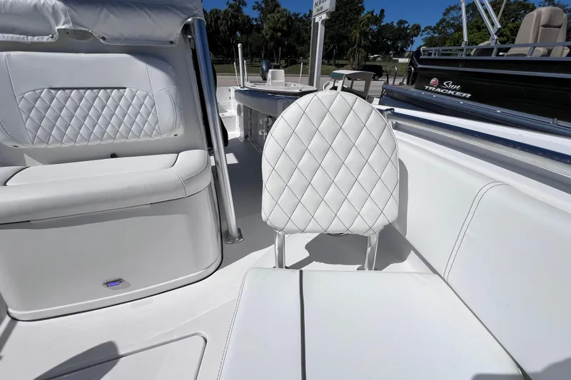 Slide: The Image of 2023 Sportsman Open 242 Center Console with white quilted seating, showcasing luxury and comfort. - 37