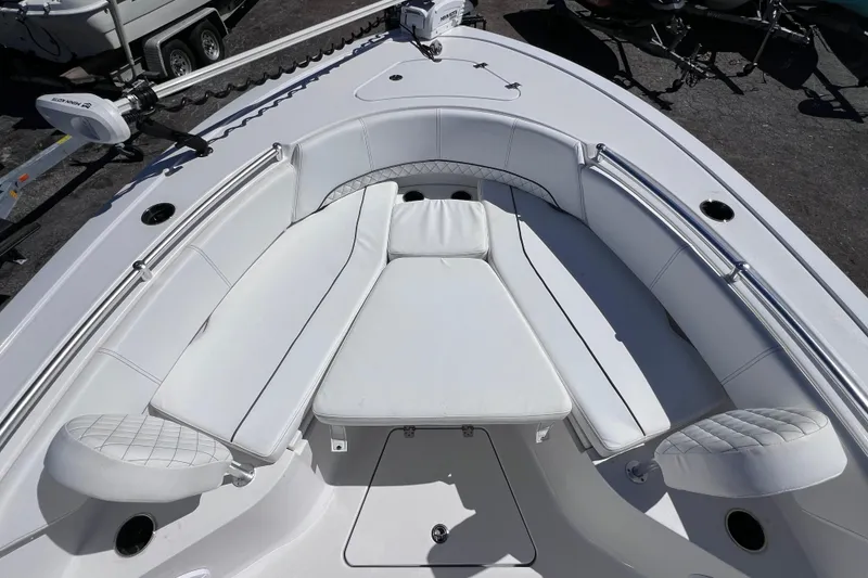 Slide: The Image of 2023 Sportsman Open 242 Center Console boat with spacious white seating area. - 45