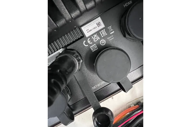 Slide: The Image of Close-up of 2023 Sportsman Open 242 Center Console electronic connections. - 48