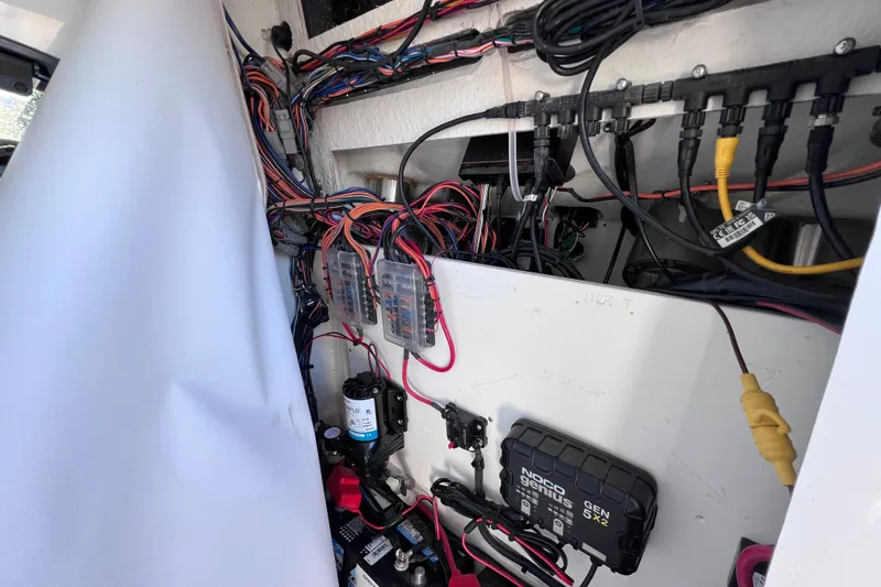 Slide: The Image of 2023 Sportsman Open 242 Center Console wiring and electrical components detail. - 49