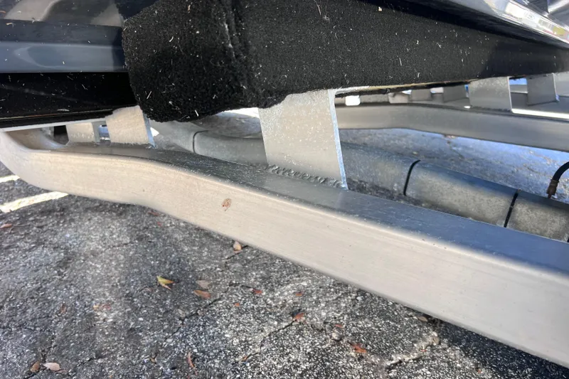 Slide: The Image of 2023 Sportsman Open 242 Center Console trailer detail on pavement. - 52