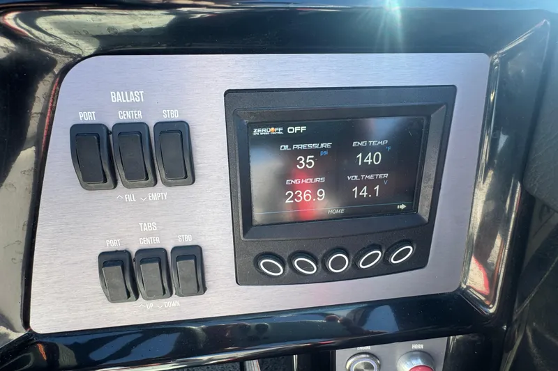 Slide: The Image of Control panel of a 2021 MasterCraft NXT24 boat showing ballast and engine metrics. - 18