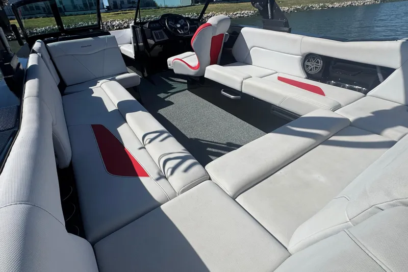 Slide: The Image of 2021 MasterCraft NXT24 boat interior with spacious seating and modern design. - 23