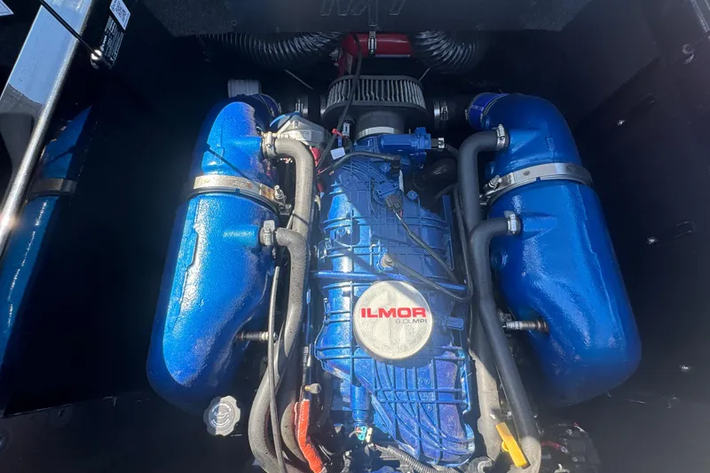 Slide: The Image of 2021 MasterCraft NXT24 Ilmor engine, blue components, detailed view. - 26