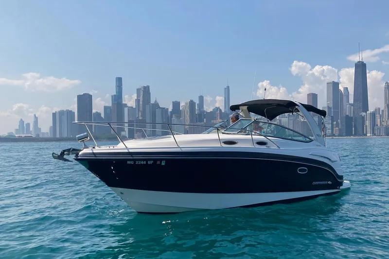 The Image of 2016 Chaparral 290 Signature boat on water with city skyline in background. - 0