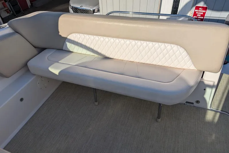 Slide: The Image of 2016 Chaparral 290 Signature boat interior with beige seating and quilted backrest. - 14