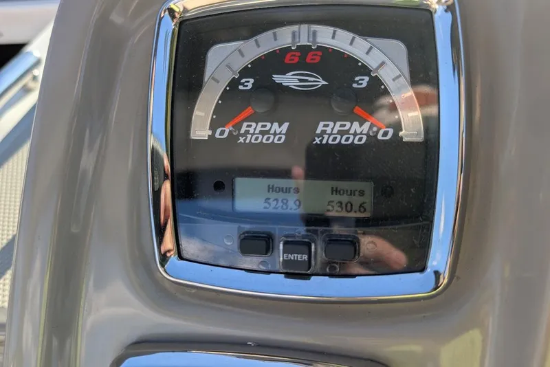 Slide: The Image of Dashboard of 2016 Chaparral 290 Signature showing RPM and engine hours. - 18