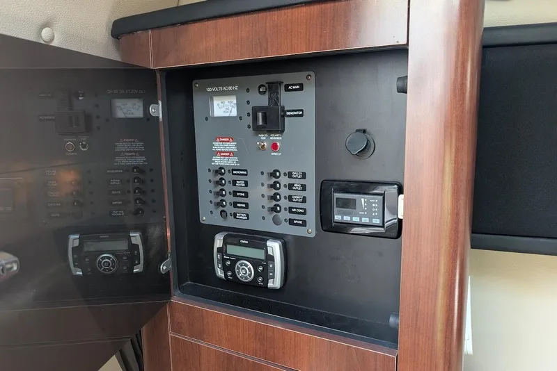 Slide: The Image of Control panel of 2016 Chaparral 290 Signature boat with electronic systems. - 26