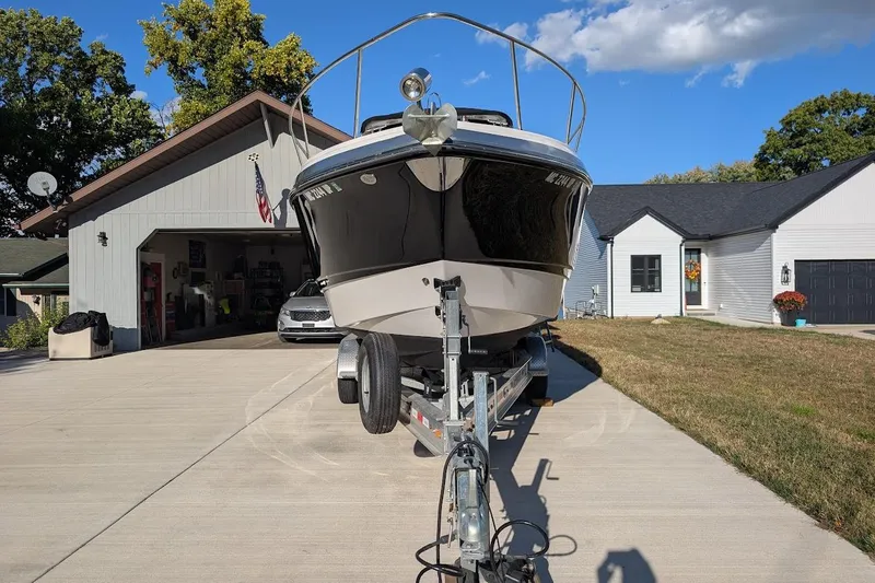 Slide: The Image of 2016 Chaparral 290 Signature boat on trailer in residential driveway. - 3