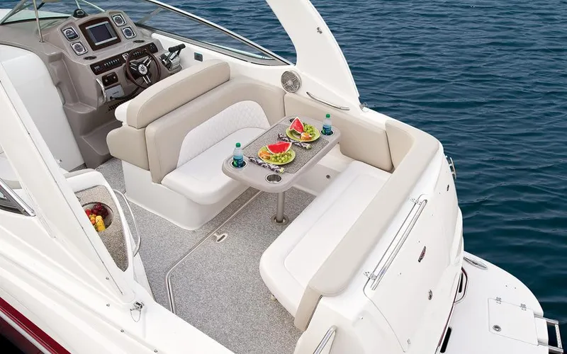 Slide: The Image of Manufacturer Provided Image: 2016 Chaparral 290 Signature boat interior with dining setup on the water. - 42