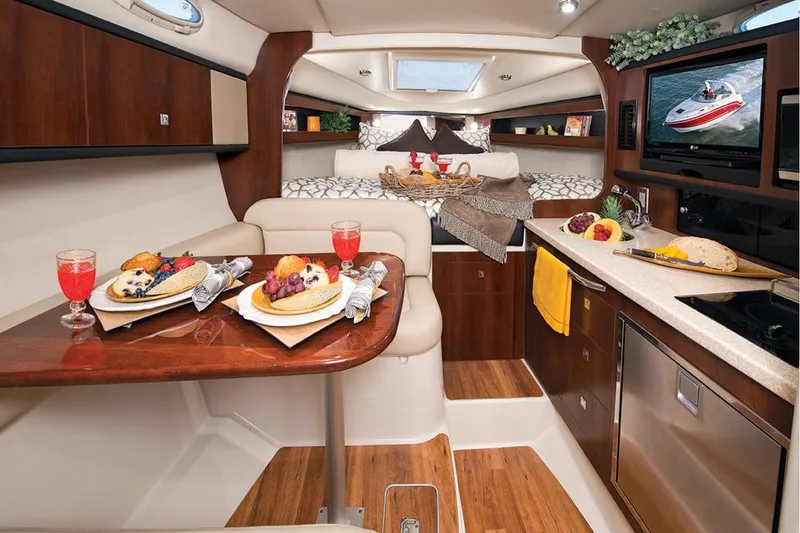 Slide: The Image of Manufacturer Provided Image: Luxurious interior of 2016 Chaparral 290 Signature yacht with dining setup. - 45