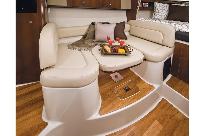 Slide: The Image of Manufacturer Provided Image: 2016 Chaparral 290 Signature interior with beige seating and wooden flooring. - 48