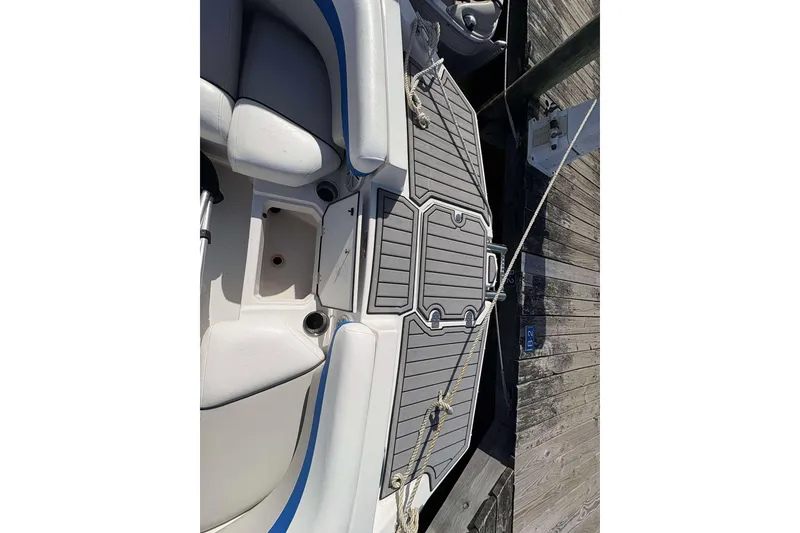 Slide: The Image of 2022 Starcraft Crossover 211 SCX OB boat interior with seating and deck details. - 18