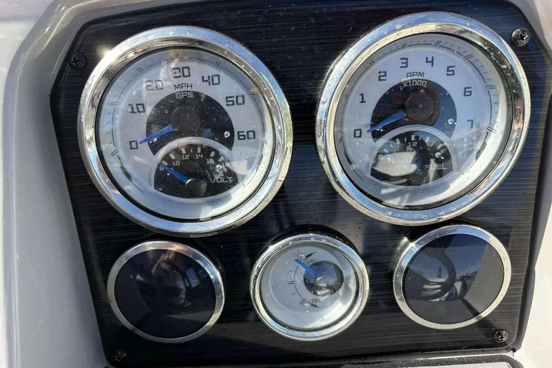 Slide: The Image of Dashboard of 2022 Starcraft Crossover 211 SCX OB with speedometer and fuel gauges. - 20
