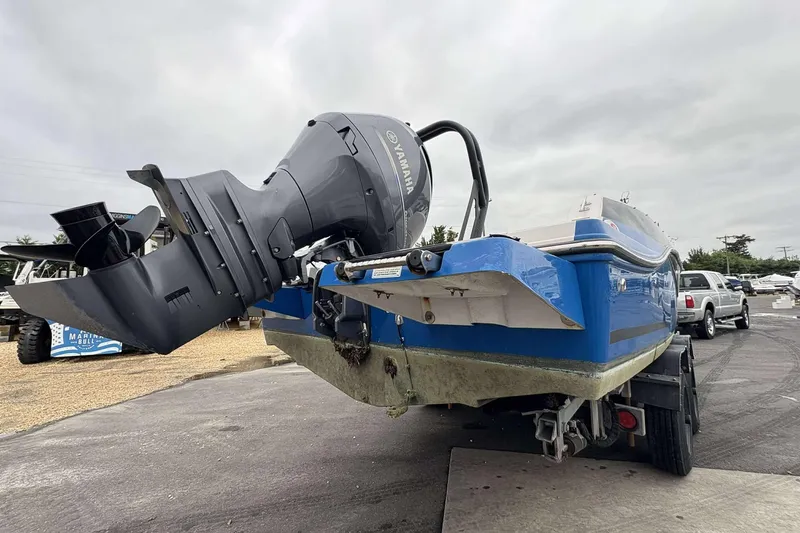 Slide: The Image of 2022 Starcraft Crossover 211 SCX OB boat with Yamaha outboard motor on trailer. - 26