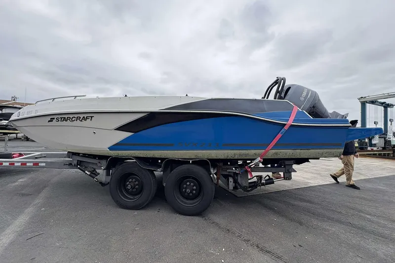 Slide: The Image of 2022 Starcraft Crossover 211 SCX OB boat on trailer, side view. - 5