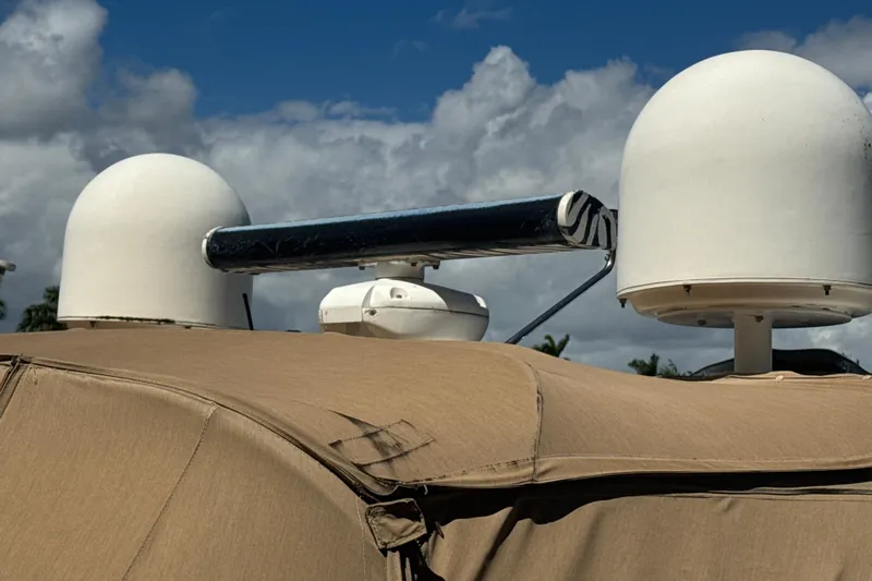 Slide: The Image of Radar equipment on a 1995 Sea Ray 500 Sundancer under a cloudy sky. - 7