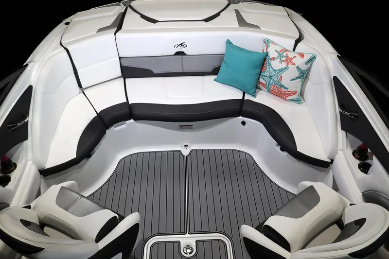 Slide: The Image of 2023 Monterey 224FS boat, rear view with ladder and covered deck, parked outdoors. - 6