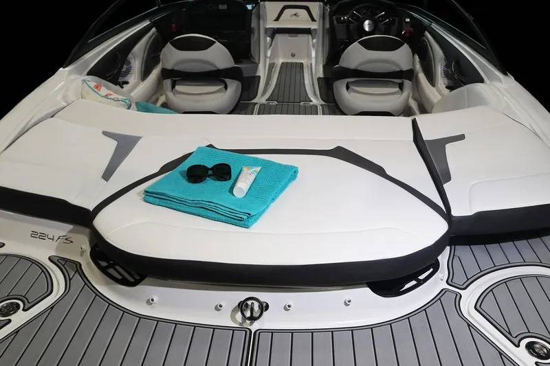 Slide: The Image of 2023 Monterey 224FS boat on trailer, parked outdoors, with black cover and canopy. - 7