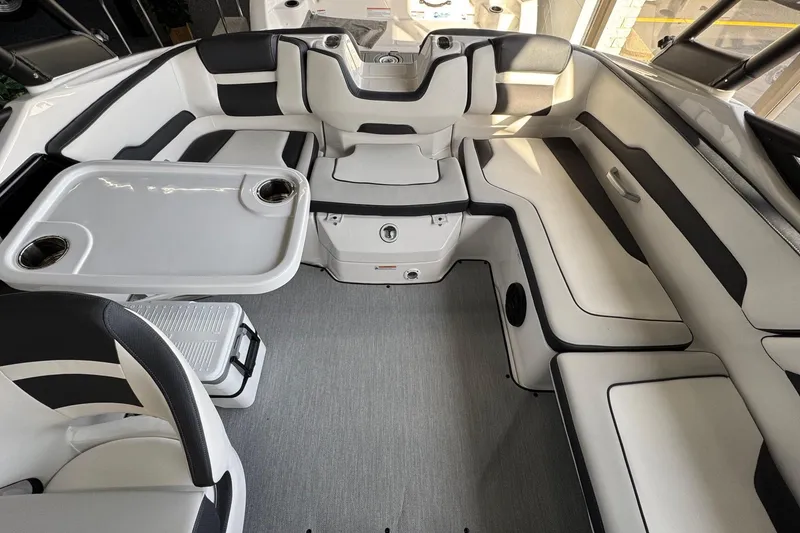 Slide: The Image of Luxurious interior of 2026 Yamaha Boats AR195, featuring sleek seating and a modern table design. - 11