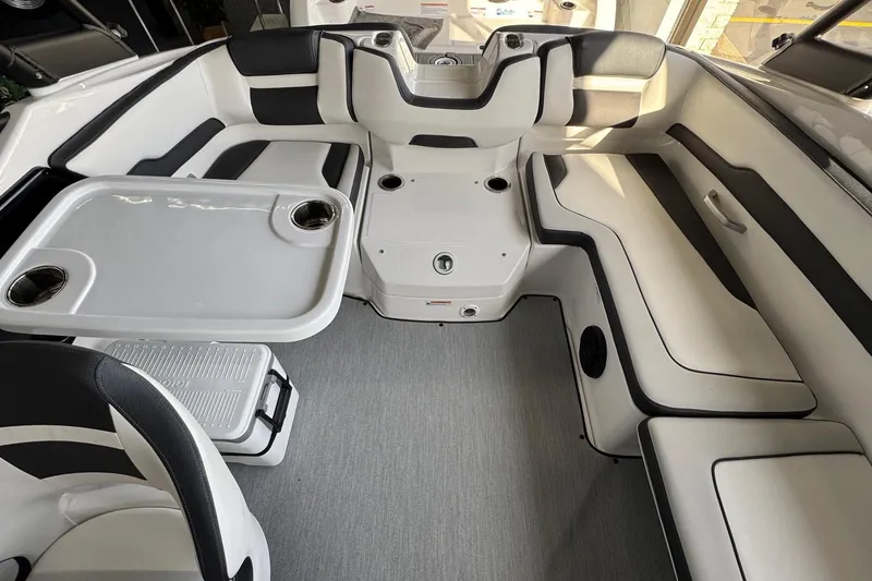 Slide: The Image of 2026 Yamaha Boats AR195 interior with sleek seating and table setup. - 12