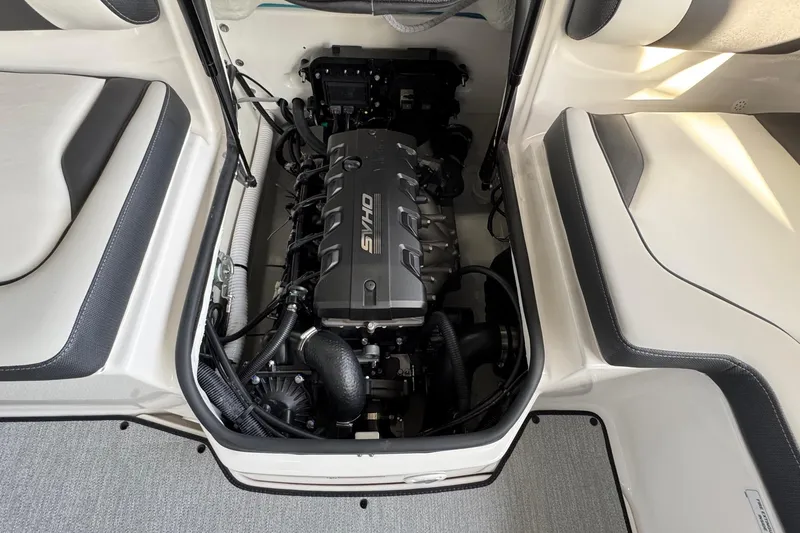 Slide: The Image of Engine compartment of 2026 Yamaha Boats AR195, showcasing sleek design and advanced technology. - 14