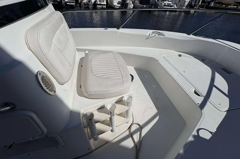 Slide: The Image of 2011 Boston Whaler 180 Dauntless boat interior with seating and storage compartments. - 10