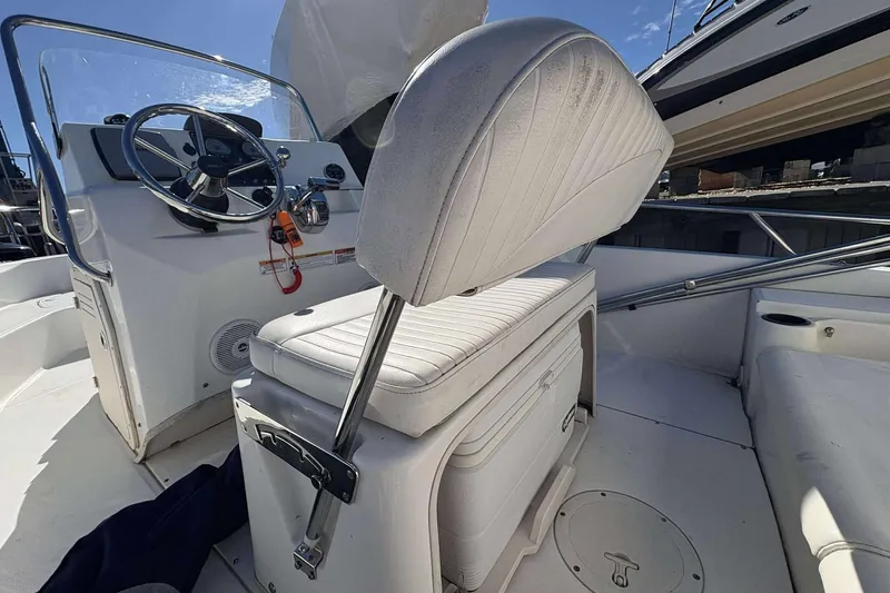 Slide: The Image of 2011 Boston Whaler 180 Dauntless boat interior with steering wheel and seating. - 15