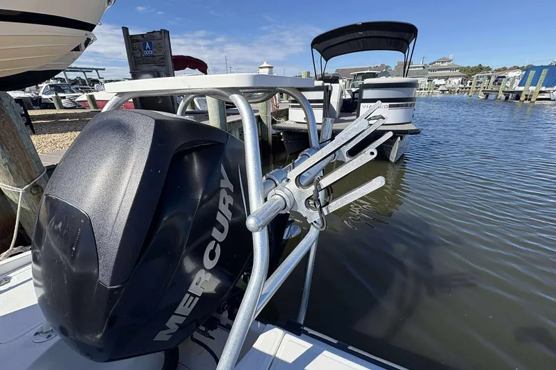 Slide: The Image of 2011 Boston Whaler 180 Dauntless with Mercury engine docked at marina. - 19