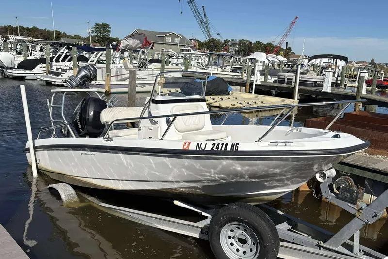 Slide: The Image of 2011 Boston Whaler 180 Dauntless boat on trailer at marina dock. - 6