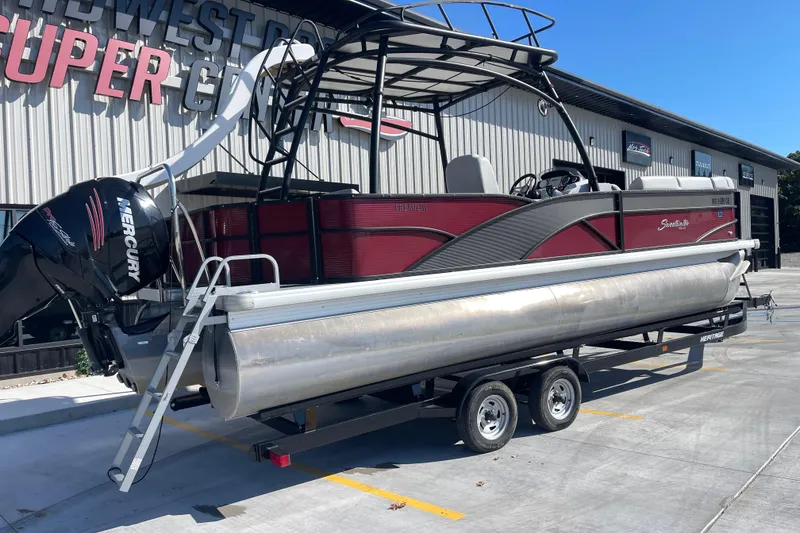 Slide: The Image of 2017 Godfrey Sweetwater 255 pontoon boat on trailer, parked outside dealership. - 3