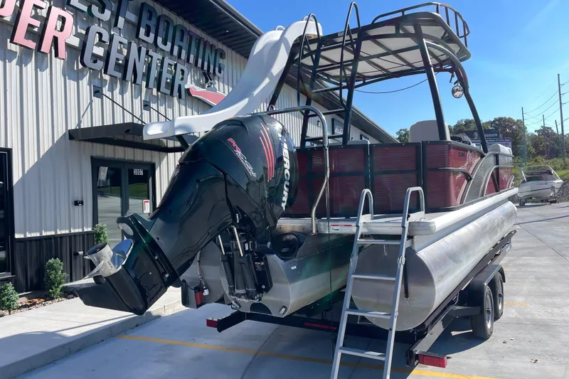 Slide: The Image of 2017 Godfrey Sweetwater 255 pontoon boat with Mercury engine at a boating center. - 5