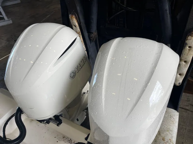 Slide: The Image of 2018 Cobia 301 Center Console with twin Yamaha outboard engines. - 17